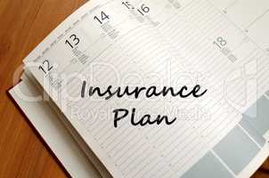 Insurance plan write on notebook