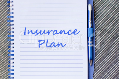 Insurance plan write on notebook