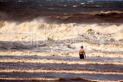 Lone Boy Standing in Sea