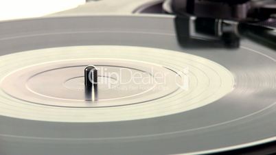 DJ Turntable. Close-up of a spinning vinyl record player.