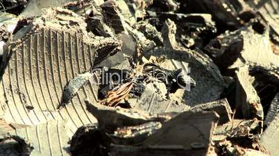 Shredded car tires pile for recycling. Close-up. tilt and defocus.