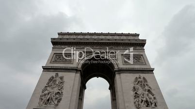 Arc De Triomphe on a cloudy day. Medium shot, centered. Zoom in and out.