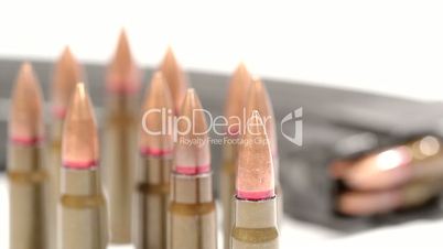 AK-47 ammunition. Defocus on a bunch of upright bullets. From the foremost to the rearmost.