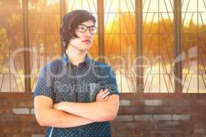 Young thoughtful businessman standing in office