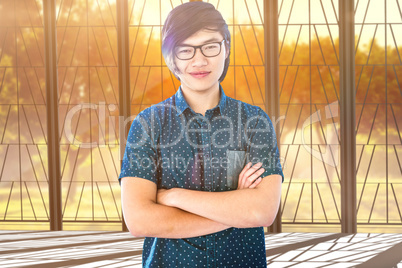 Young thoughtful businessman standing in office