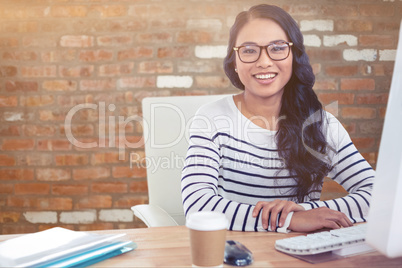 Young thoughtful businessman standing in office