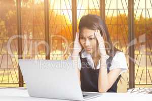 Young thoughtful businessman standing in office
