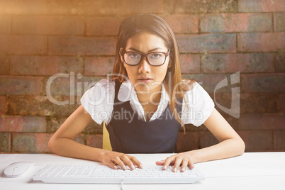 Young thoughtful businessman standing in office
