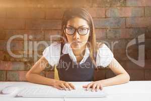 Young thoughtful businessman standing in office