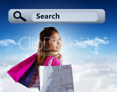 Caucasian woman holding shopping bags outdoor