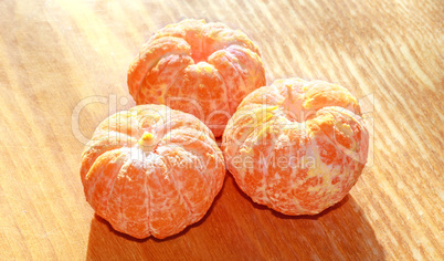 Three peeled tangerines