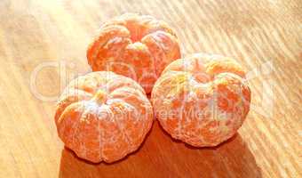 Three peeled tangerines