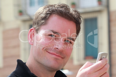 Handsome Man Holding Mobile Phone