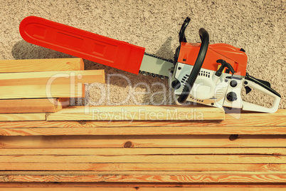 Chainsaw and lumber.