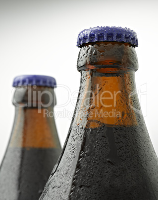 Beer bottle covered with water drops