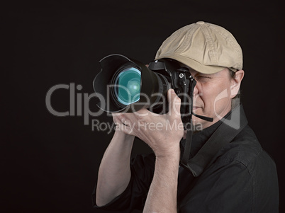 Photographer looking through camera