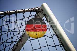 Soccerball in net with the flag of Germany