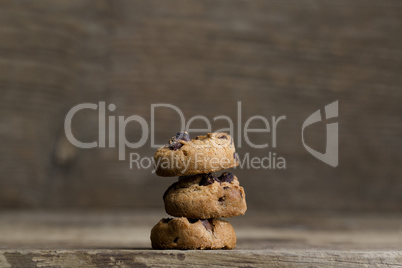 Brown cookies on wooden background