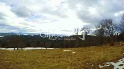 Last Snow in the Forested Mountains. Time Lapse