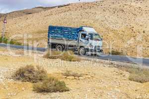 The truck coming down the mountain road. Jordan.