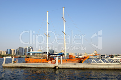 The wooden yacht is in a port of Dubai Creek, United Arab Emirat