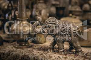 Detailed close-up elephant figurine made of metal.