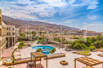 Hotel swimming pool with views of the desert rocks