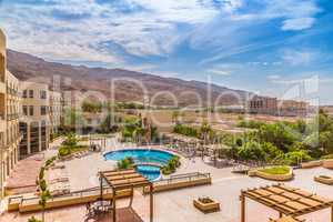 Hotel swimming pool with views of the desert rocks
