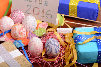 Easter background with eggs, ribbons and spring decoration