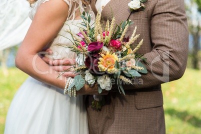 Bride and groom with bouqet