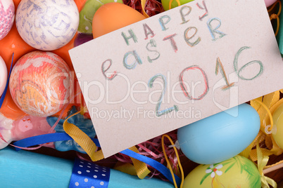 Easter background with eggs, ribbons and spring decoration