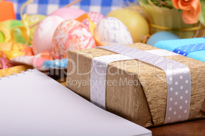 Easter background with eggs, ribbons and spring decoration