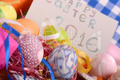 Easter background with eggs, ribbons and spring decoration