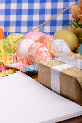 Easter background with eggs, ribbons and spring decoration