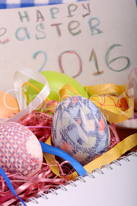 Easter background with eggs, ribbons and spring decoration