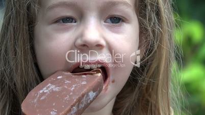 Toddler Girl Eating Chocolate Popsicle