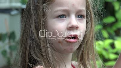 Toddler Girl Eating Chocolate