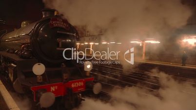Night Scene of a Steam Train Pulling Off at Victoria Station in London