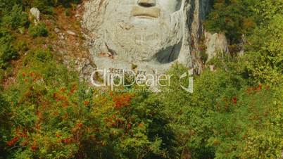 Decebalus (Decebal) king rock statue by the Danube River on a sunny day
