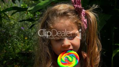 Adorable Child With Candy