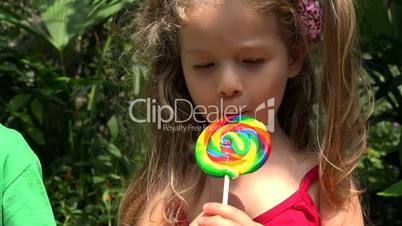 Young Girl Eating Lollipop
