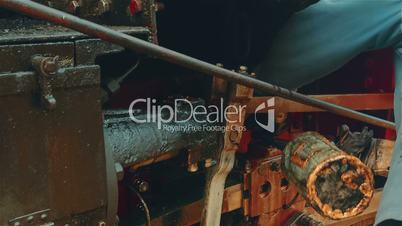 Technician Changing the Oil of an Industrial Engine