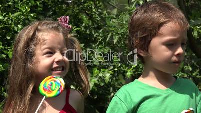 Boy And Girl Eating Candy