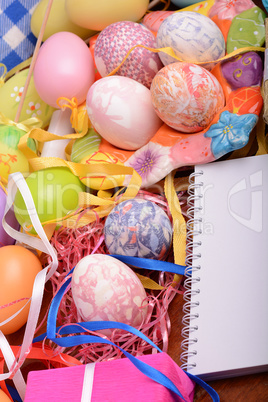 Easter background with eggs, ribbons and spring decoration