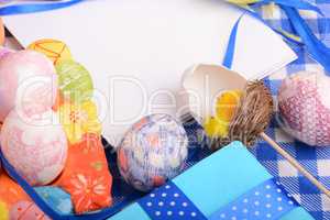Assorted Easter coloured eggs in the paper egg box