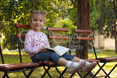 little girl with book