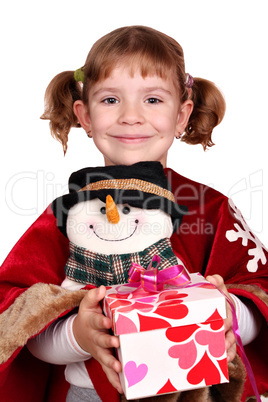 little girl holding a Christmas present