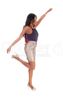 Young African American woman dancing.