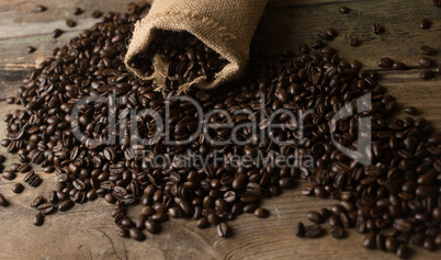 Fresh coffee beans on wood