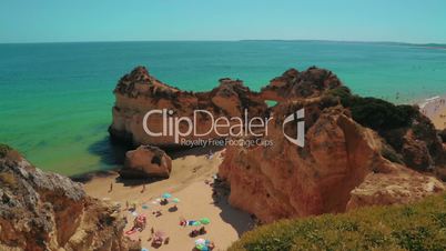 Panoramic Shot of a Rocky Beach with Tourists in the Algarve, Portugal